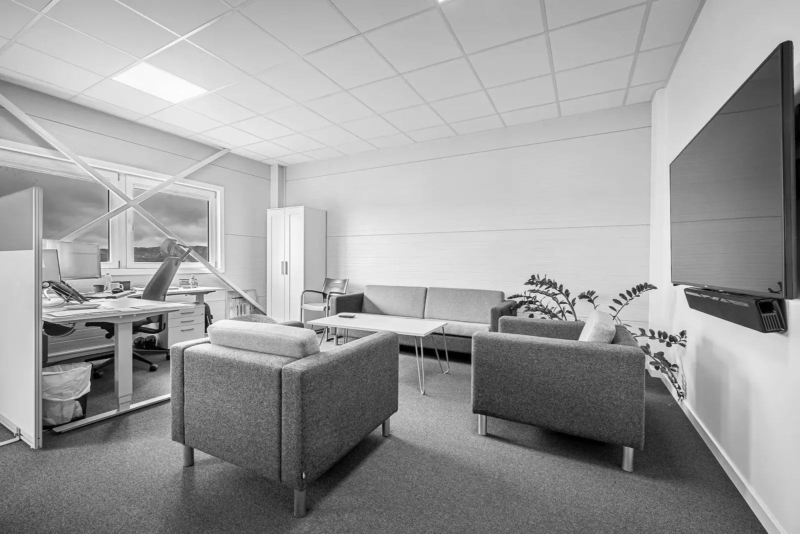 Open-plan office interior, black and white